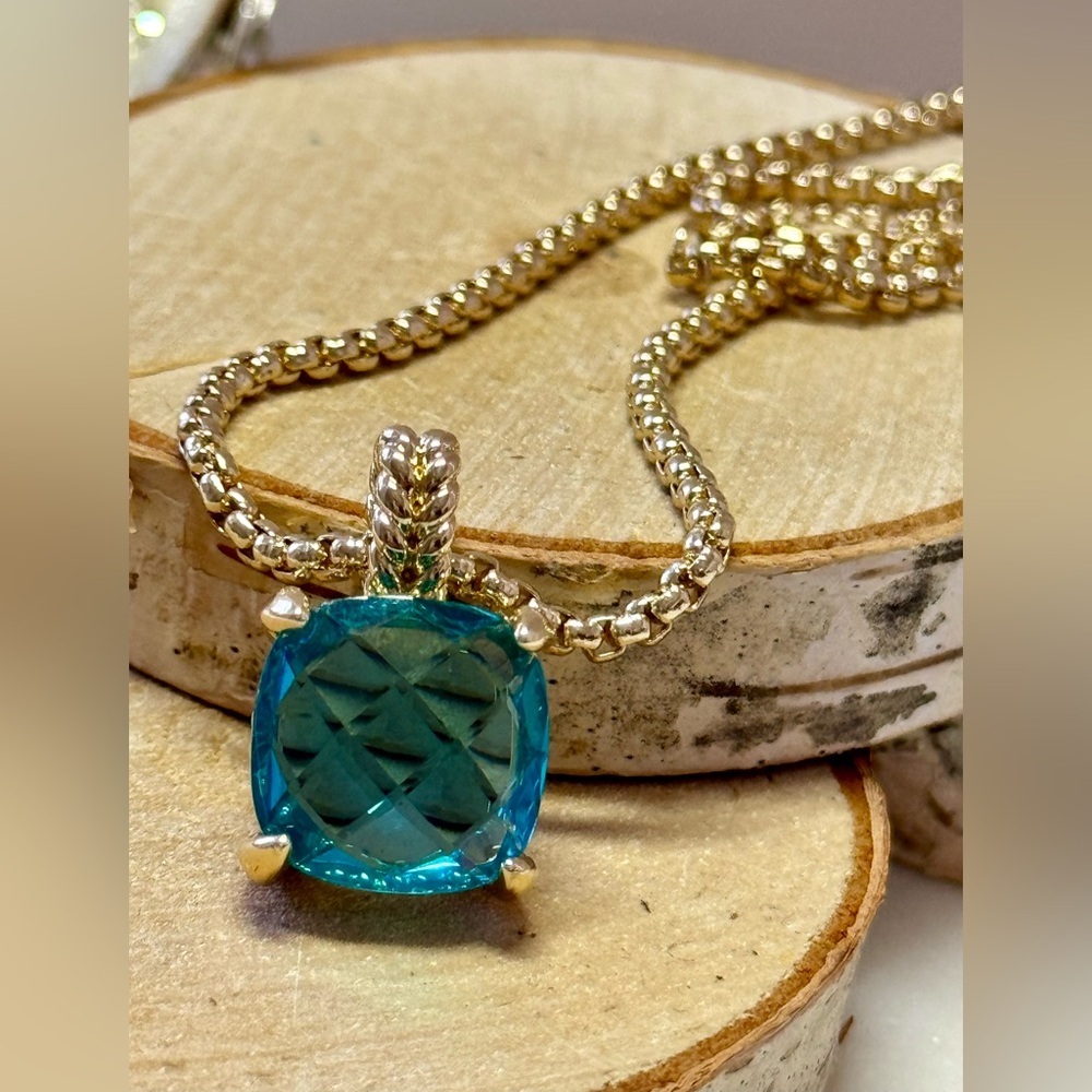Aquamarine CZ pendant paired with beautiful sturdy gold chain necklace